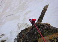 Initial abseil from the summit to gain the exposed fin for a very airy hanging anchor.