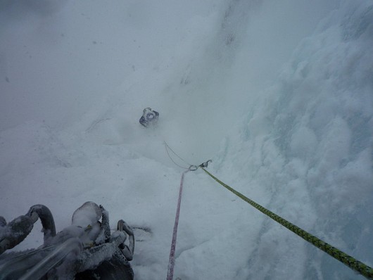 Richard catching a bit of spindrift on the belay at the bottom of the crux pitch  © Phil Ingle