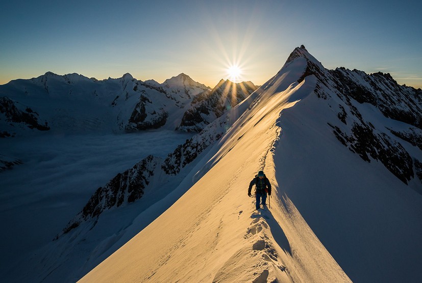 Stuart climbing from the Aletschjoch at sunrise  © Ben Tibbetts