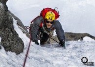 Topping out of the crux pitch 2 on Chere Couloir