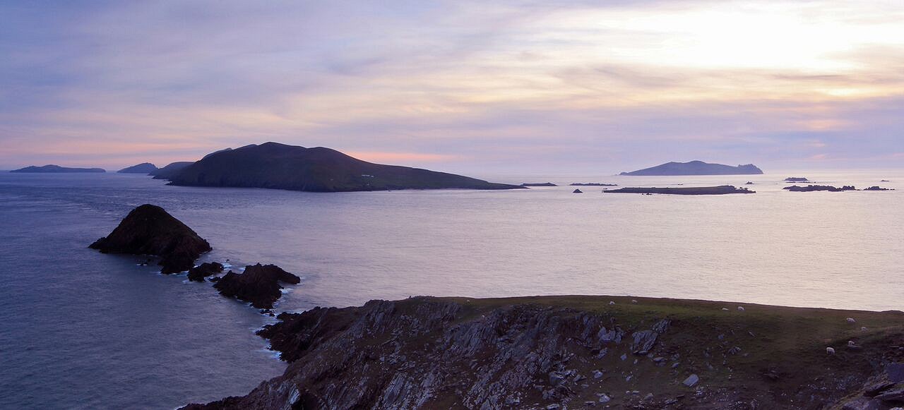 Sunset over Great Blasket Island, with Inishtooskert to its right  © Adrian Hendroff