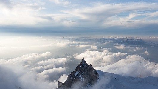 Chamonix's Aiguille du Midi as seen from the summit of Mont Blanc du Tacul after a long day's climbing on the Gervasutti Pillar  © Tim Oliver