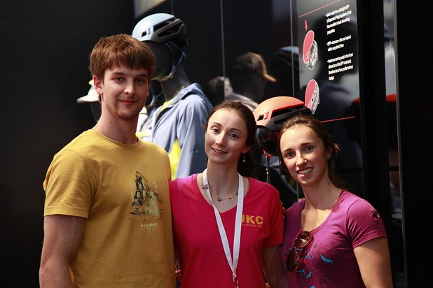 Natalie Berry catches up with German bouldering stars Jan Hojer and Jule Wurm at the Mammut stand  © Jack Geldard