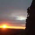Me, climbing 'high buttress arete' against another beautiful sunset at Windgather Rocks
