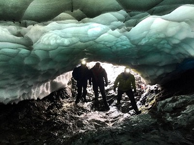 Exploring a snow tunnel on Ben Nevis this August  © Iain Cameron