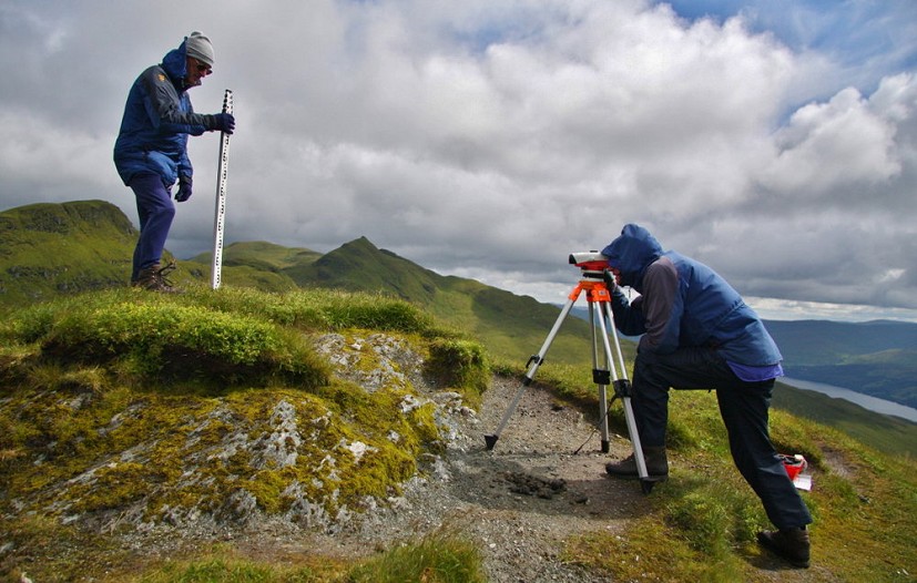Using a level and staff to determine the high point of Creag na Caillich, formerly a Munro Top  © Myrddyn Phillips