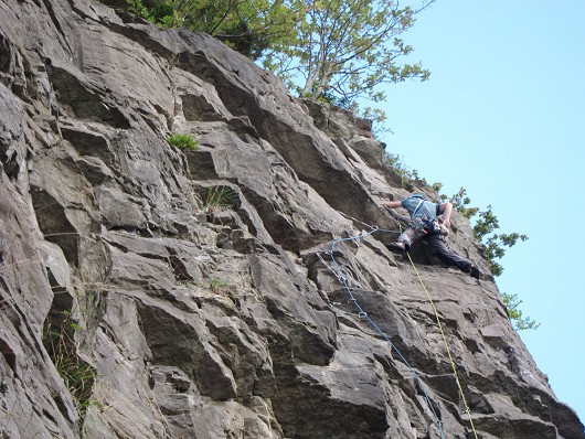 Dan overcoming the final roof of The Lich on Main Wall, Avon Gorge  © Steve Bartle