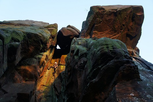 Remy Veness leading Raven Rock Gully Left-hand as the sun sets on the Roaches.  © SamN