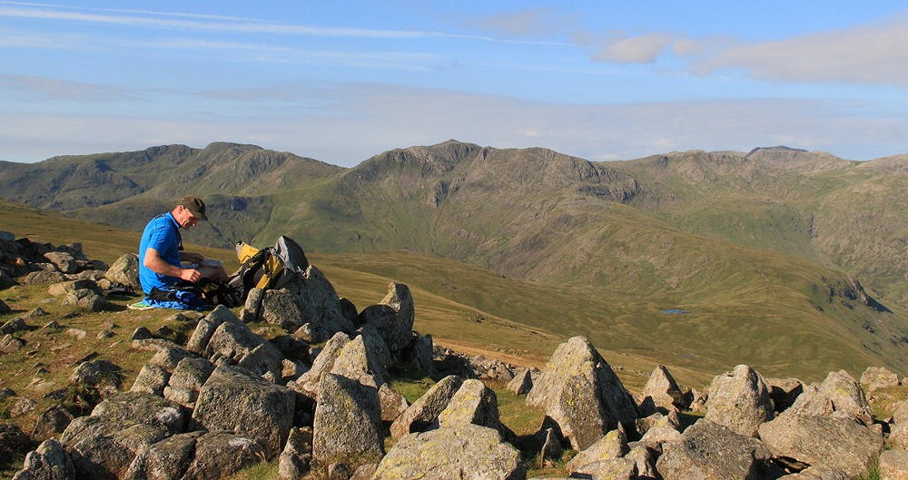 Taking a breather on High Raise, en route to the Scafells from Helvellyn  © Dan Bailey