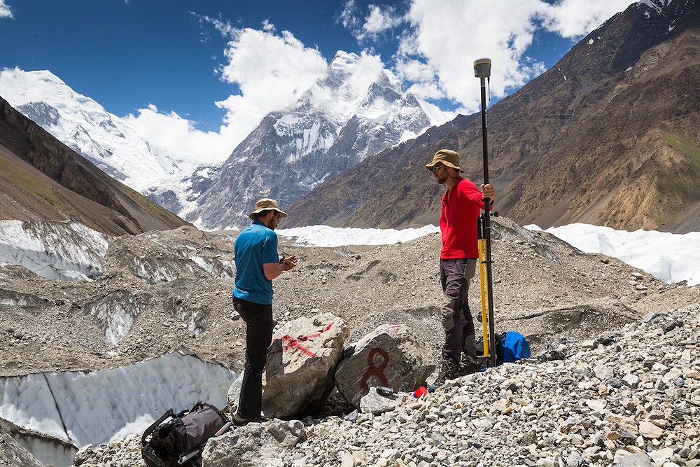 Sergiu Jiduc and Oliver Forster carrying out a RTK GPS survey using a Trimble RTK GNSS Receiver.  © Tim Taylor Photography, Karakoram Anomaly Project.