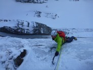 Following Rich Cross (Alpine Guides) up the ice smear on Gemini Direct