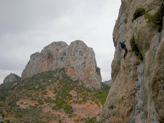 Climber at sector Coll Piqué with Paret del Grau apparent beyond  © LeeWood