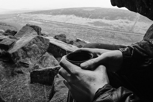 Hot coffee in cold wet hands. Sheltering from the snow in a tiny cave at Stannage having bailed from Manchester Buttress.   © John Clinch (Ampthill)