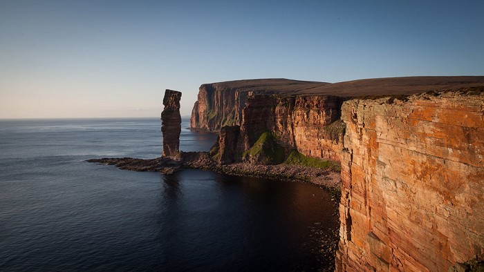 The Old Man of Hoy and St. Johns Head in the evening sun  © Rob Greenwood - UKClimbing