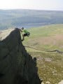 Jules on the exposed but easy final moves on Nasal Buttress, Dovestones Edge (HS 4b)