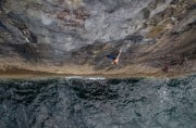 Colm Shannon shaking out before the crux sequence on the first ascent of 'The Jelly Situation' Fr 7c+/8a S1/2.<br>© Josh Willett