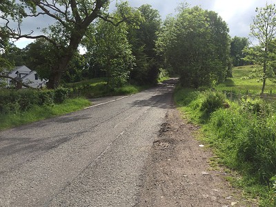 The parking area.  The boggy field is directly on the right.  The better access is forwards up the road on the right.  © gacamp