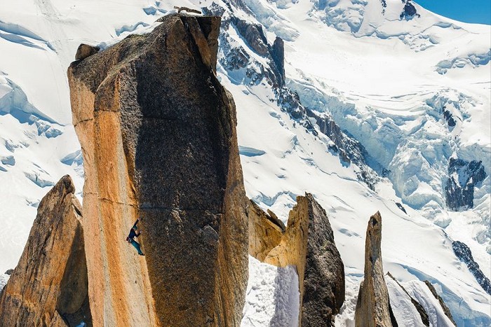Emma Twyford balancing her way up 'Arete des Cosmiques' (8a+)  © Rab