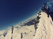At summit of Allalinhorn 4027m, looking towards Matterhorn