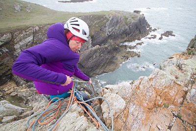 Libby Peters testing the Alpha Direct on the ever-windy sea crags of N.Wales.  © Rab