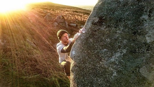 Sunset session on the classic arete problem, matching hands for the traverse, just after the crux.   © andyban92