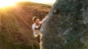 Sunset session on the classic arete problem, matching hands for the traverse, just after the crux.