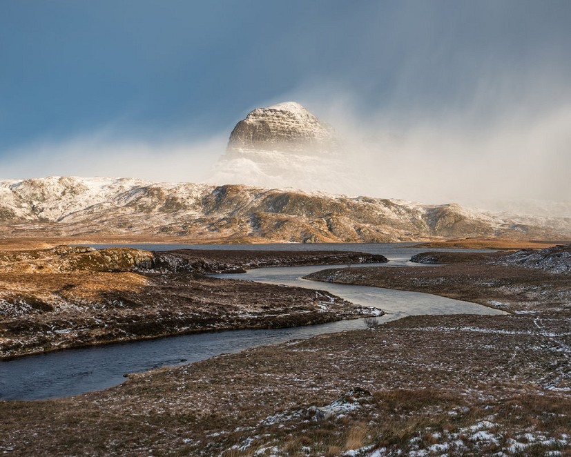 Suilven emerges from a winter storm  © Hamish Frost