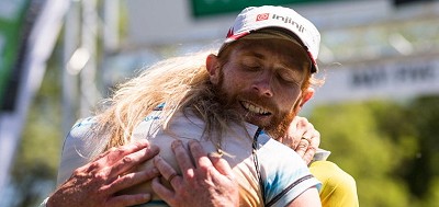 Marcus Scotney embraced by wife Jen after winning the 2017 Berghaus Dragon's Back Race  © Guillam Casanova