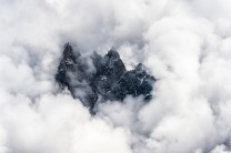 Afternoon clouds surround the Aiguille de Blaitière, Aiguille des Ciseaux, Aiguille du Fou in the Mont Blanc region of F