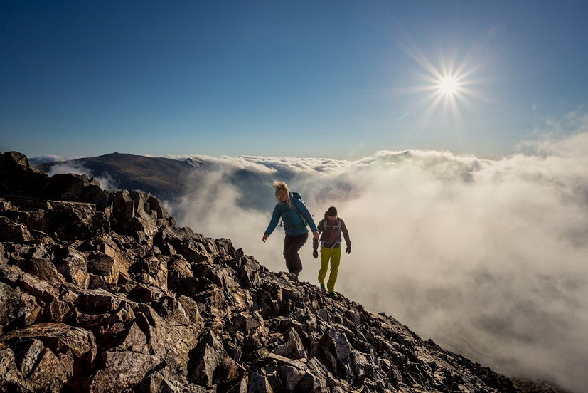 Above the clouds on Crib Goch, shot with a narrow aperture for a 'starburst' sun effect  © Nadir Khan