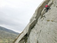 Leading the first pitch on Direct Route (Milestone Buttress)