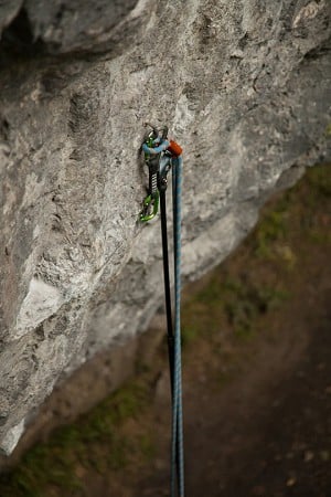 Climber 700 unclipping a quickdraw from a bolt  © Rob Greenwood - UKC