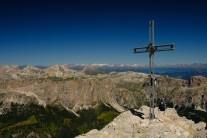 Piz da Lech summit cross with view north towards Puez-Odle group