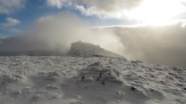 Approaching the summit as the clouds break