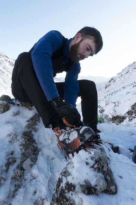 Martin McKenna fixing a semi step-in crampon to the Tech ODs  © Dan Bailey