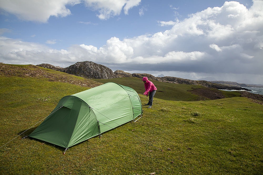 Victoria pegging out the Viso 2 at Clashtoll. It's hard to tell but the winds were high!  © Martin McKenna