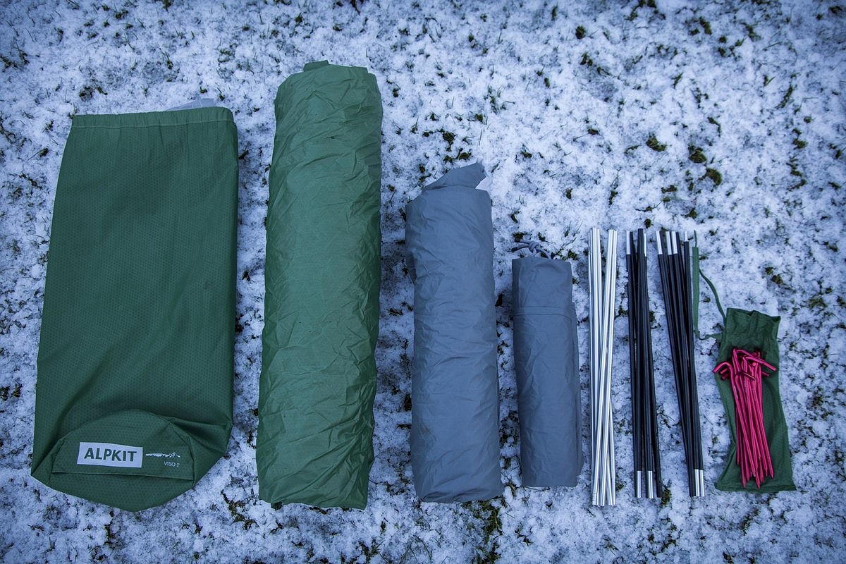 Left to right: tent bag, flysheet, inner, porch tarp, middle pole, 2 end poles and pegs  © Martin McKenna