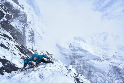 Greg Boswell shaking out whilst climbing a new line on the east face of Tower Ridge  © Hamish Frost