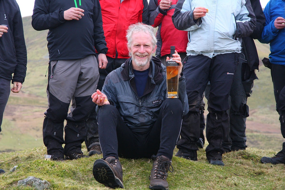 Rob Woodall celebrating at the summit of Ffridd Las  © Myrddyn Phillips
