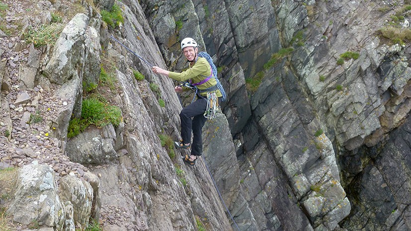 Abseiling into Craig Caerfai. Plenty of loose rock at the top here to watch out for.  © Sam James-Louwerse