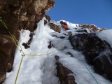 2nd pitch of right-facing icy corner immediately left of the direct start of 1978 Face Route. ?FA