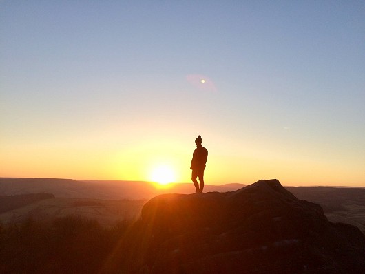 Topping out at sunset, The Business Boulder, Stanage  © Ian Wignall