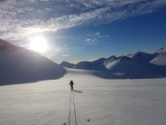 Skiing down the glacier after a winter ascent of Nørdre Bukkehøe, Jotunheimen