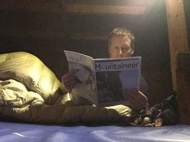 Passing the time taking photos of myself pretending to read in a very cold and otherwise unoccupied hut...  © Dan Bailey