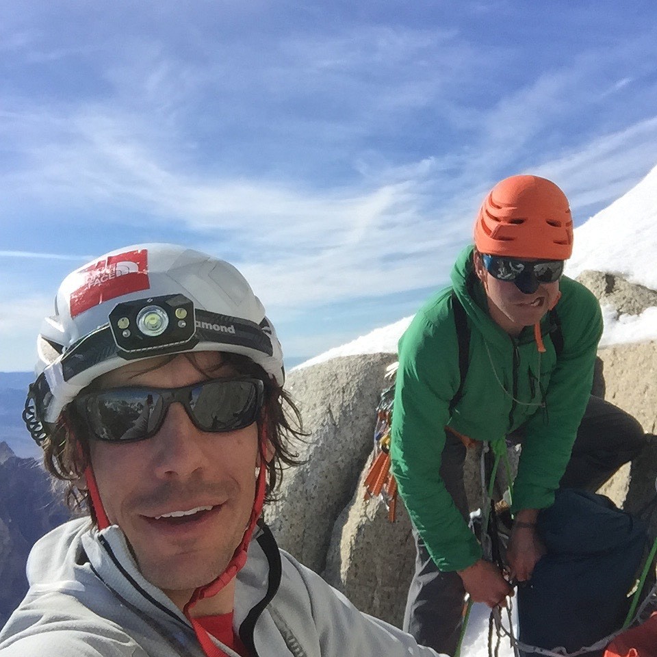 Group selfie while changing into crampons, at the top of the rock on Spigolo dei Bimbi.  © Colin Haley