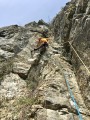 Approaching the crux on the second pitch of Scar (VS 4c). A few brambles(!) but great dry limestone in April sunshine.