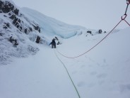 Sumit pitch under cornice; Chris Reid searching for a way over.