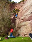 Onsighting 'Darkness Falling' at North Berwick Law - stem the corner crux before you balance up the slab