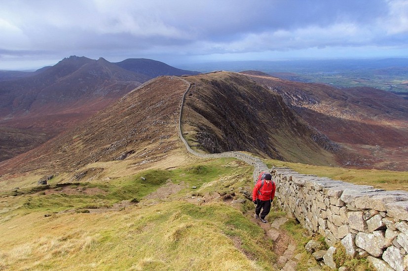 The Mourne Wall extending towards Slieve Corragh, with Slieve Bearnagh in the distance  © Adrian Hendroff