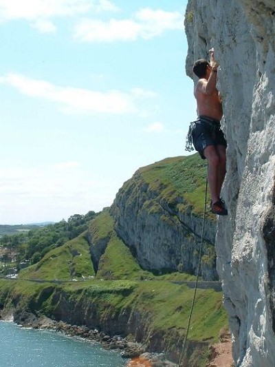 Ryan Mconnell on Excursion (E2 5b) on the Great Orme, Wales  © Gruff
